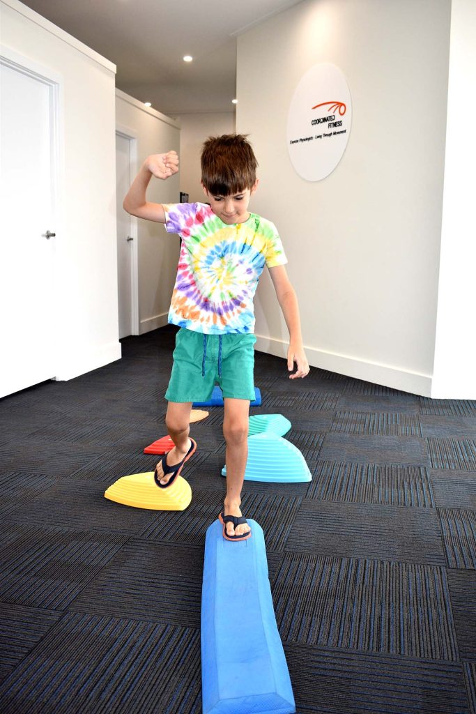 kid walking across beam